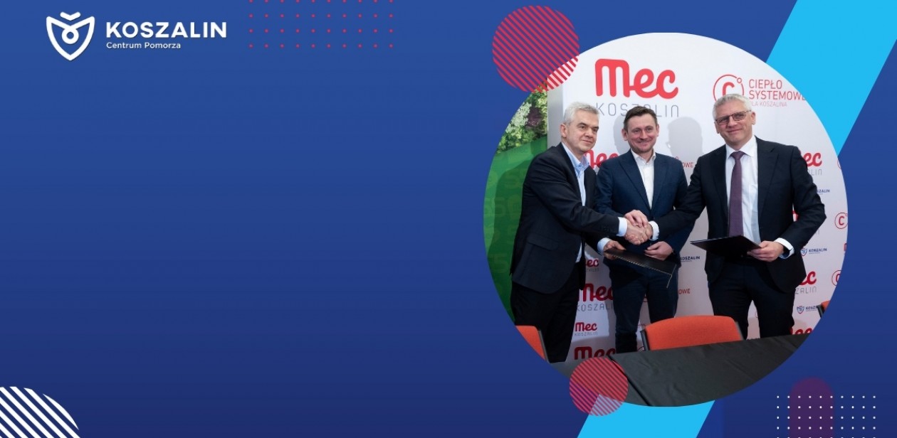 Na grafice znajduje się Prezydent Miasta. Osoby na grafice podają sobie dłonie. 