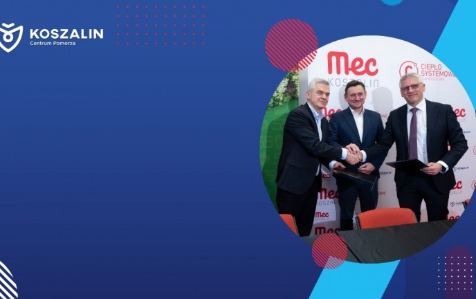 Na grafice znajduje się Prezydent Miasta. Osoby na grafice podają sobie dłonie. 