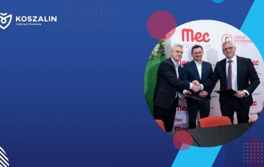 Na grafice znajduje się Prezydent Miasta. Osoby na grafice podają sobie dłonie. 